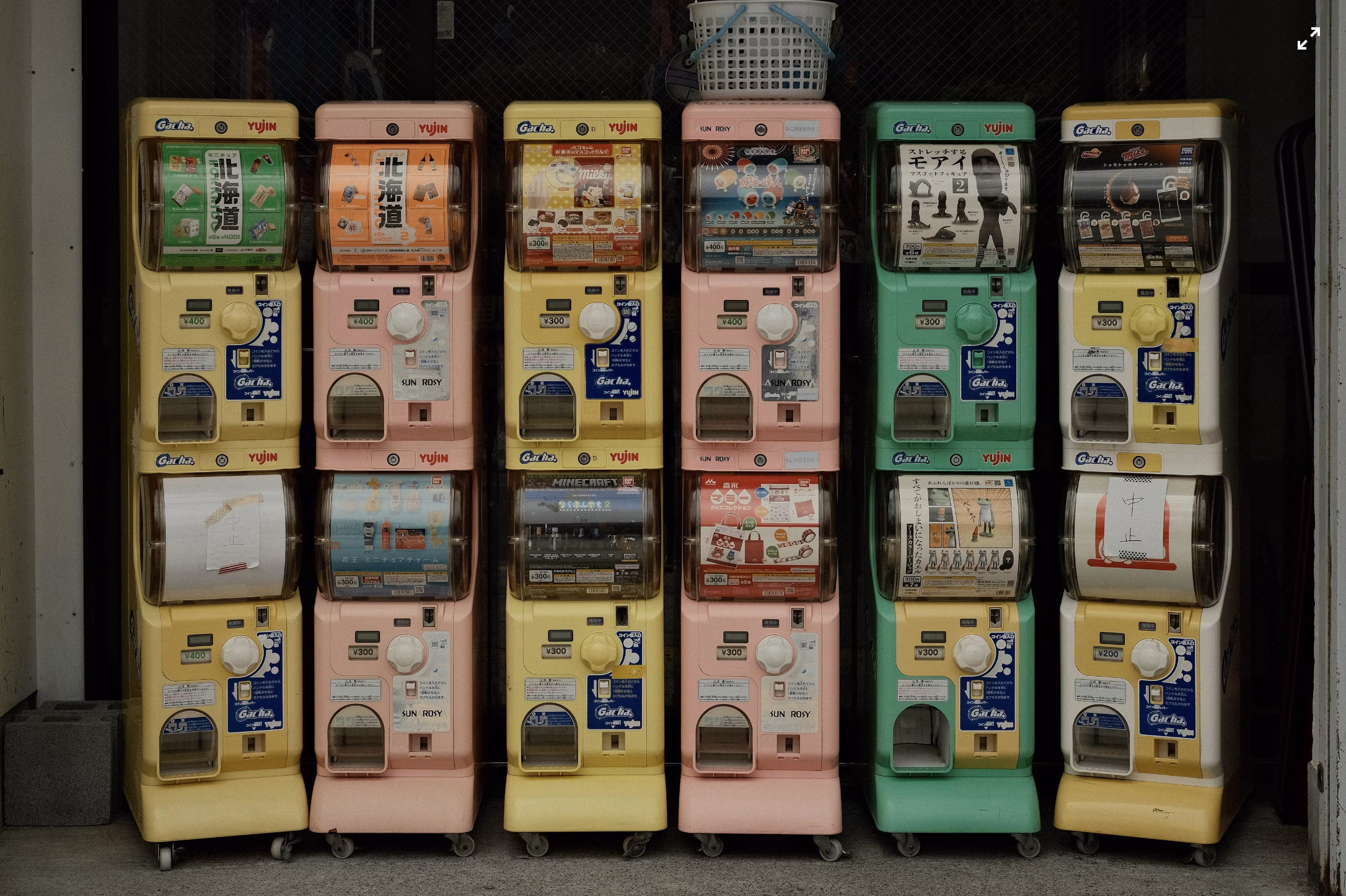 Row of gachapon capsule machines illustrating the origin of gacha